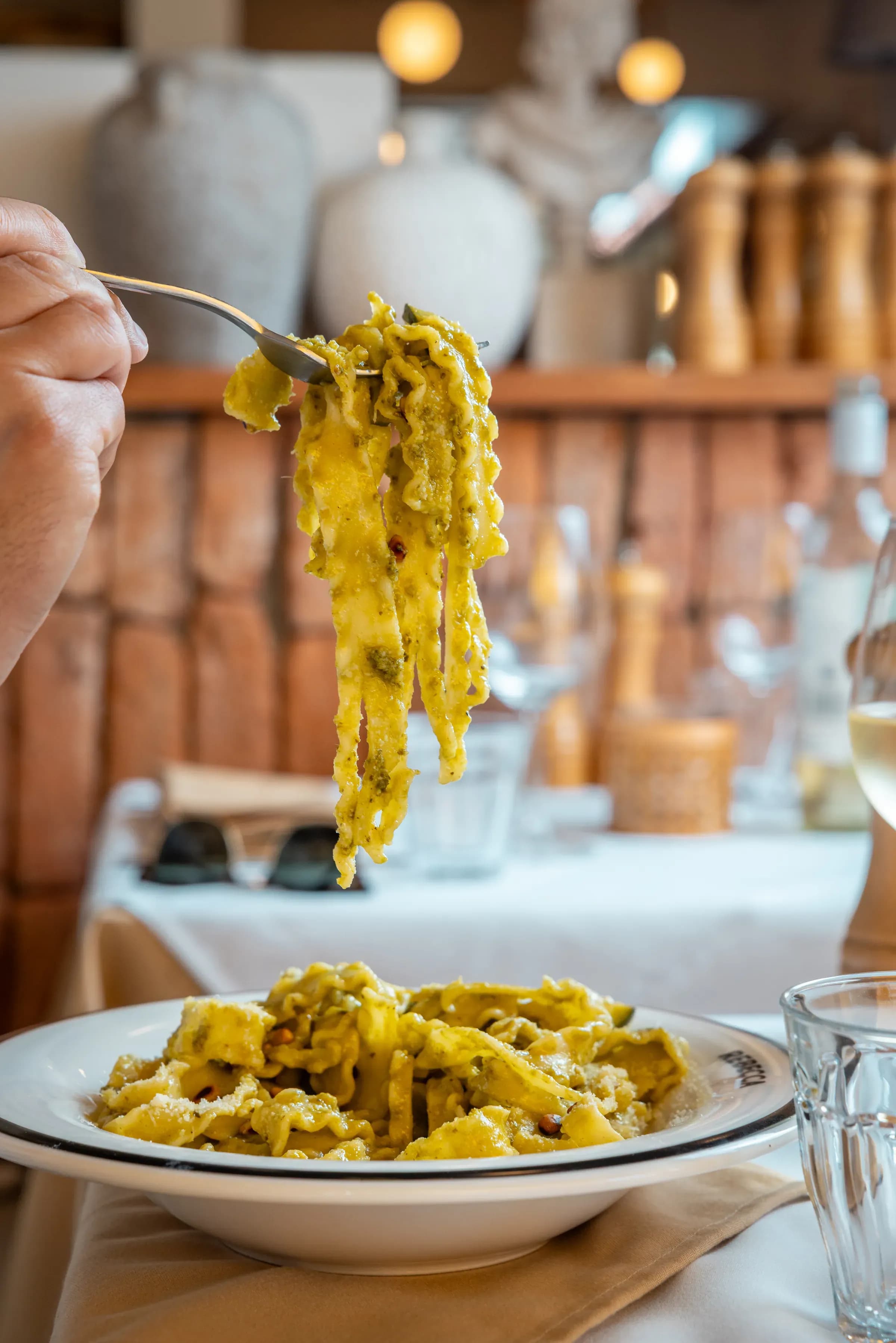 Pasta lifted from the pan on a fork