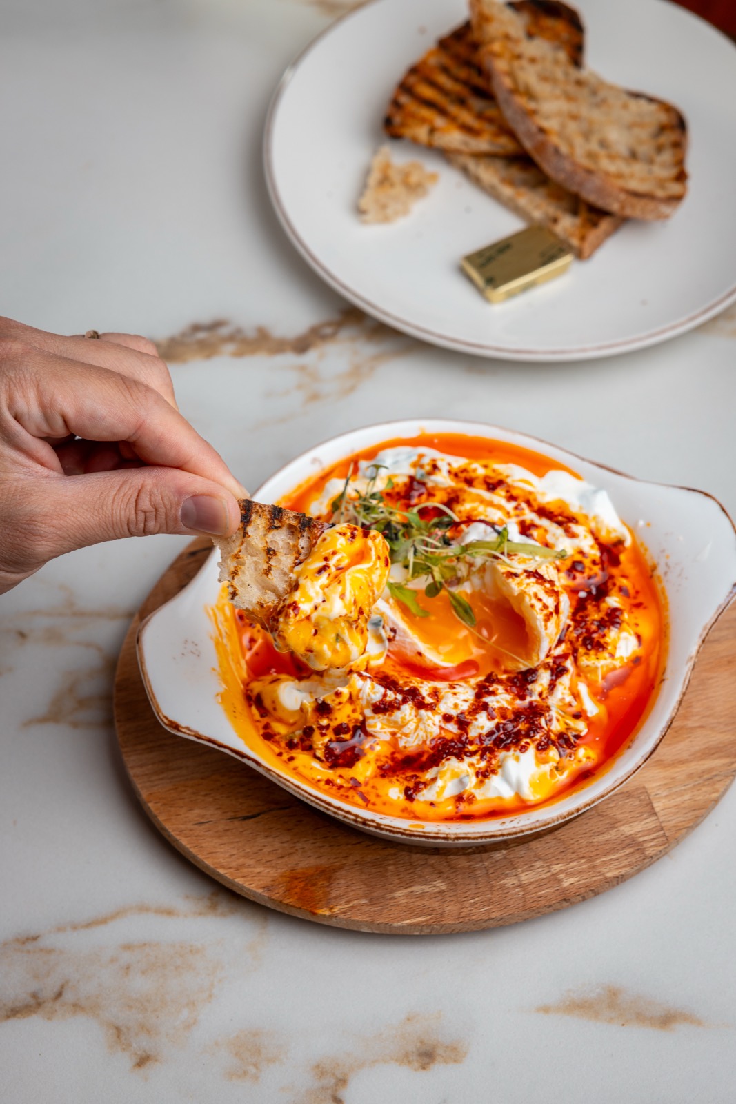 Poached eggs, chilli butter